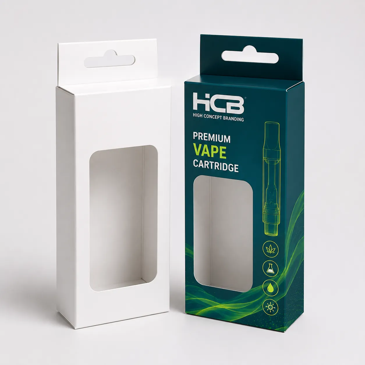 Printed vape cartridge boxes with a die cut window and hanging tab next to white mockup. class=